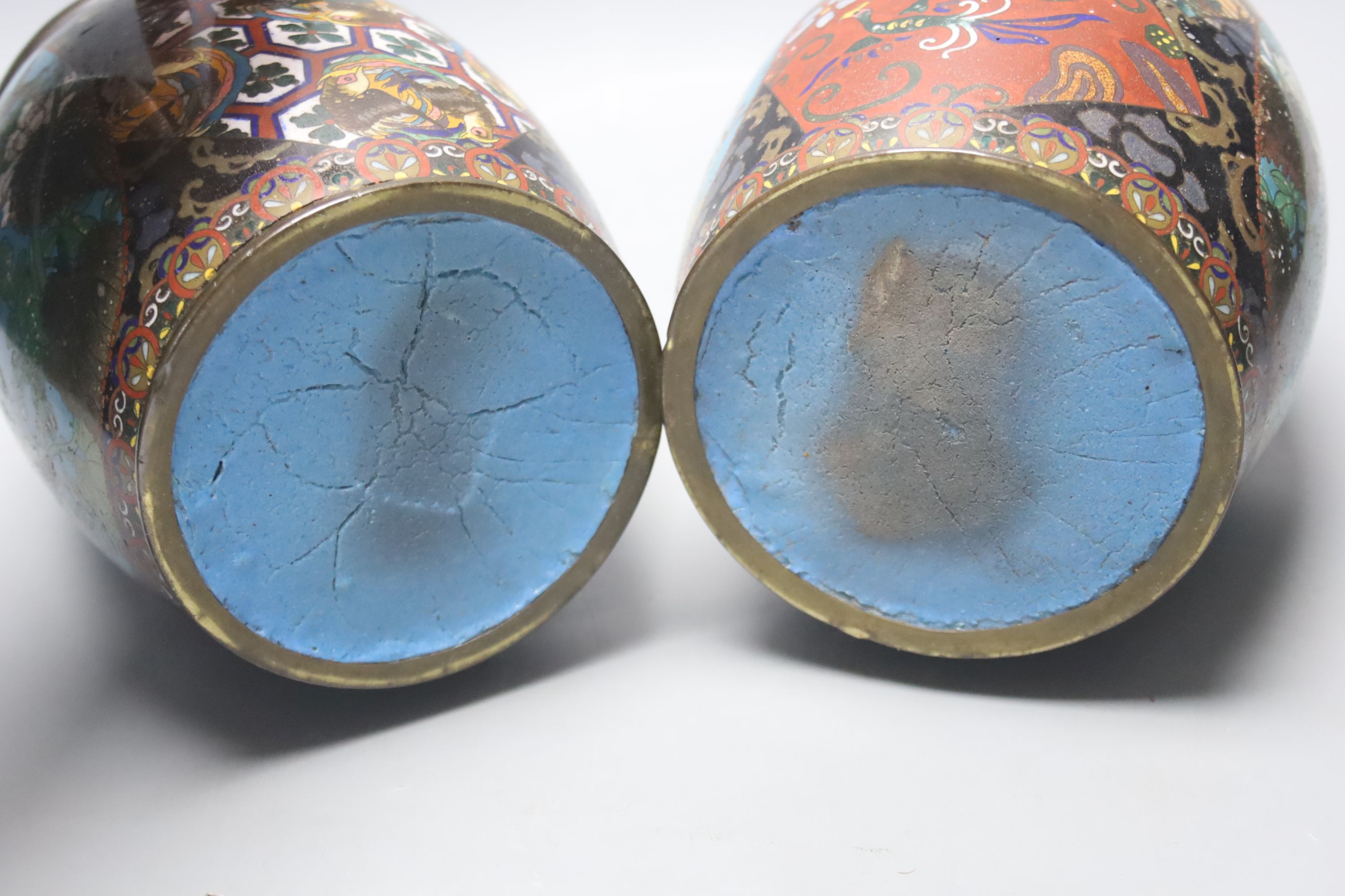 A pair of Japanese cloisonne enamel barrel-shaped vases and a similar bottle vase